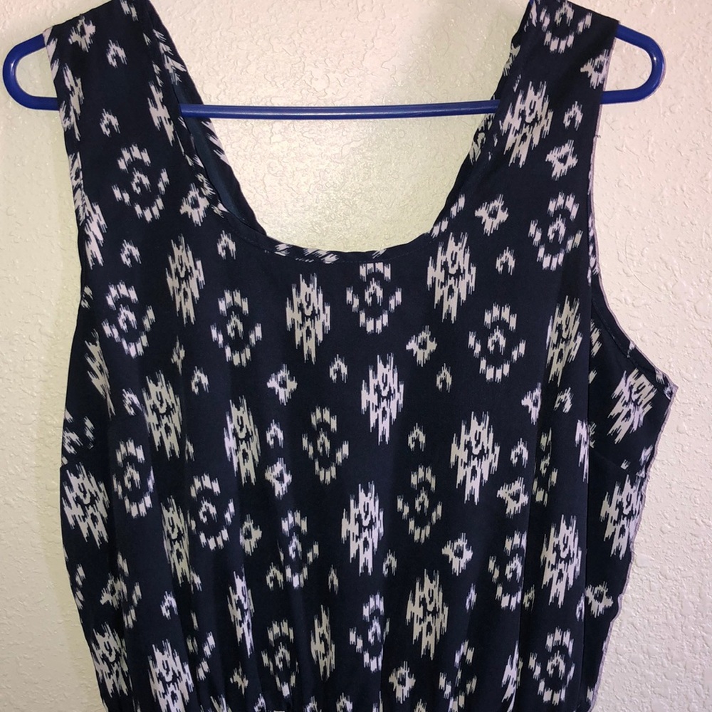 Blue romper with white designs